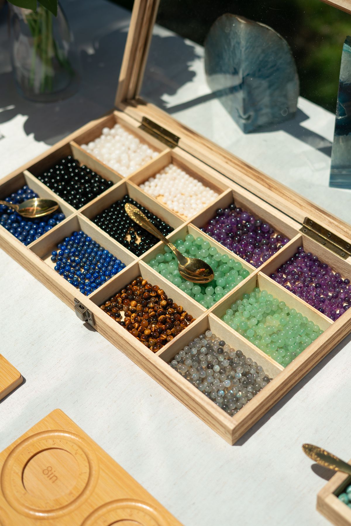 A tray of sorted crystal beads ready for a custom design