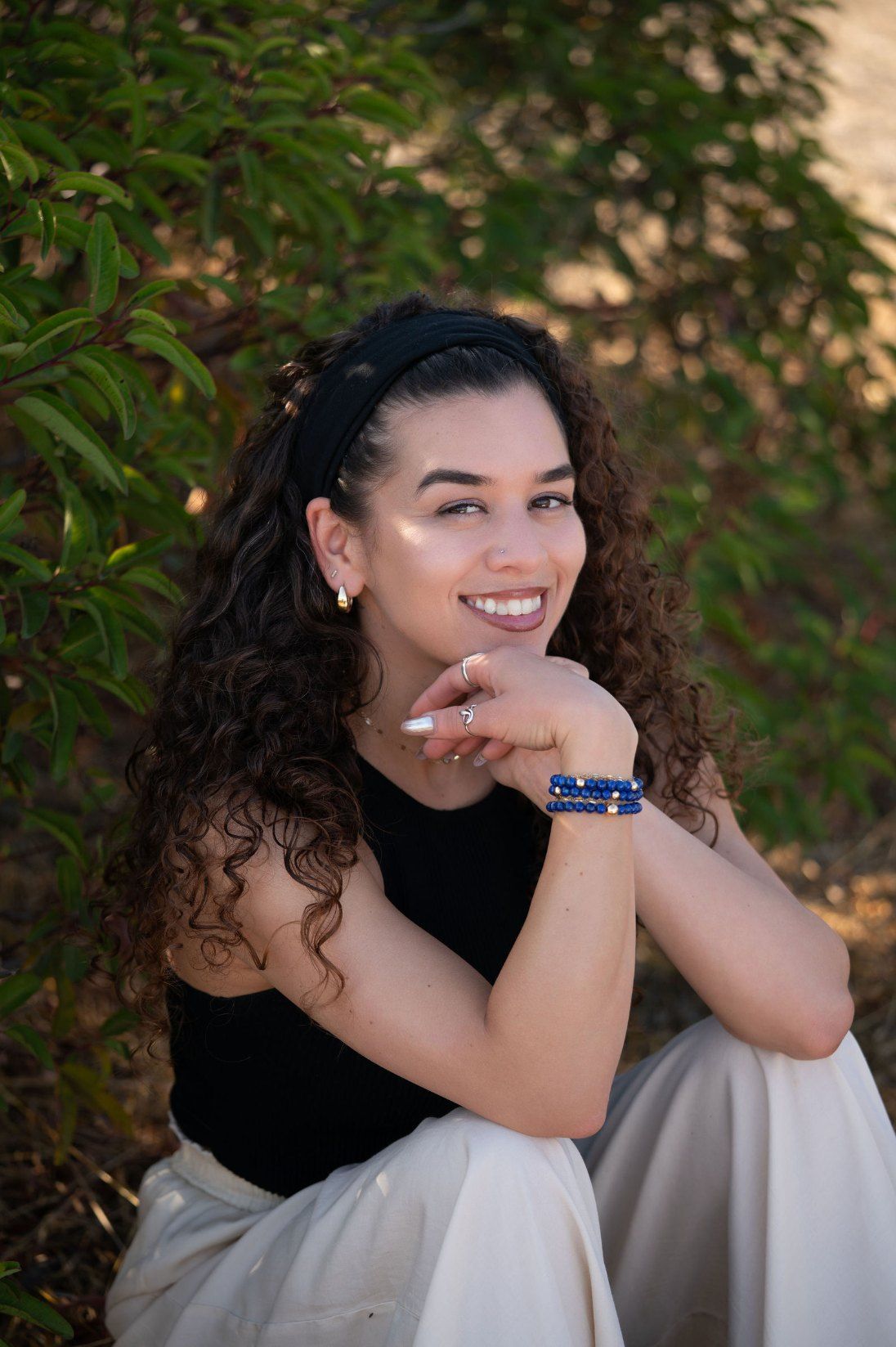 Char-Leen Christy-Rose, founder of Crystal Rose Collections, smiling with her chin on her hand